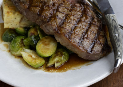 Close up delmonico steak with brussels sprouts