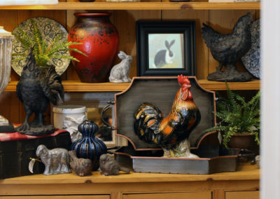 Interior design decor rooster statues on shelves