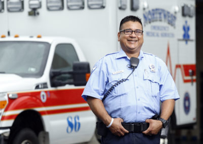 Portrait of an EMT in front of an ambulance