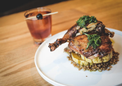 Chicken thigh dish with a cocktail